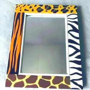 Pier 1  animal print wooden vinyl wrapped mirror. 14 x 11 inches.